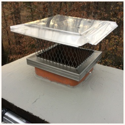 Chimney cap repair: Stainless chimney cap installed to prevent more squirrel and birds in the fireplace. The crown has been sealed to prevent moisture damage.